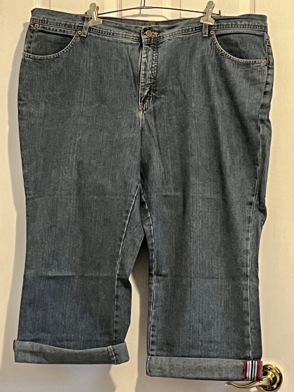 Denim capri with colourful seam feature in bottom hem